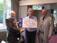 Presentation of 500 cheque to Maggie Little from DAAT