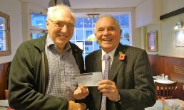 Lion Bob presentating 250 to Colin Wright towards towns Christmas lights as thank you.
