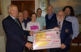 Lions group round Joy from CLIC Sargent with £2000