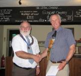 Lion President Brian thanking Lions Steve for a pint