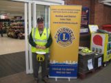 Lion Bill working the bucket at Tesco Honiton