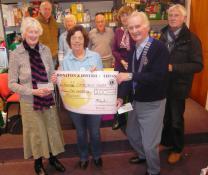 Lions and Lions Ladies give £100 each to Honiton Foodbank