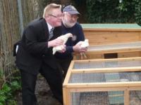 Lion President Brian Richards with Chickens and one of the pupils