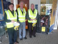 Changeover at Tesco Easter collection with Lions Bernard, Roy and Barry collecting