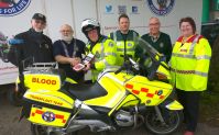 Lions £2100 DeFib being installed on First responder bike