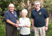 Lions Bill and Barnard presenting the cheque for £250 to Vision OM